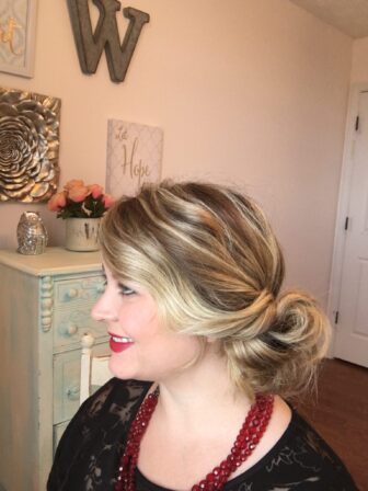 A classic chic side updo hairstyle is perfect for your more formal Christmas events. To create this hairstyle start by making a bun to the side of your head leaving the front section of your hair out. take long bobby pins and secure your bun in a swirl pattern. Take the remaining front section of your hair and loosely pin it into your bun. You are now for your Christmas Party!!