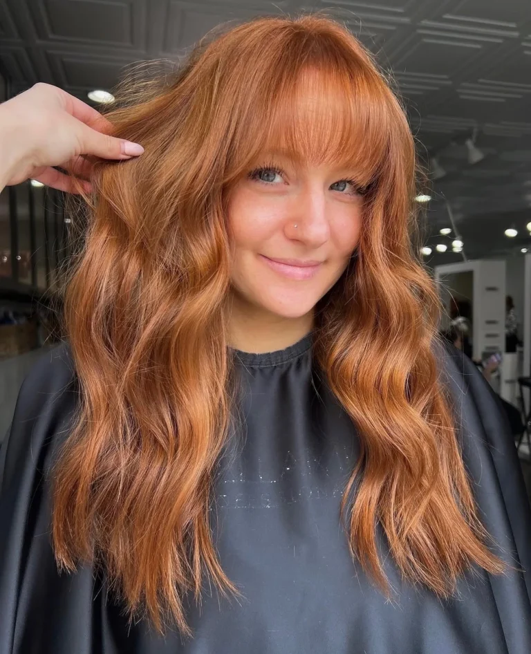 Copper red color with curtain bangs and soft waves by Whitney Evans Beauty