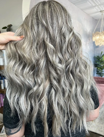 Long silver and gray blended hair in soft waves