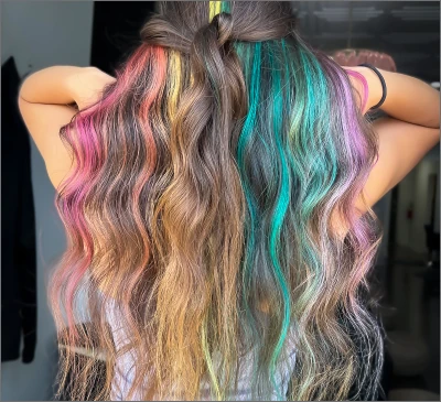 Long waves with vivid rainbow color in pink, purple, teal and yellow