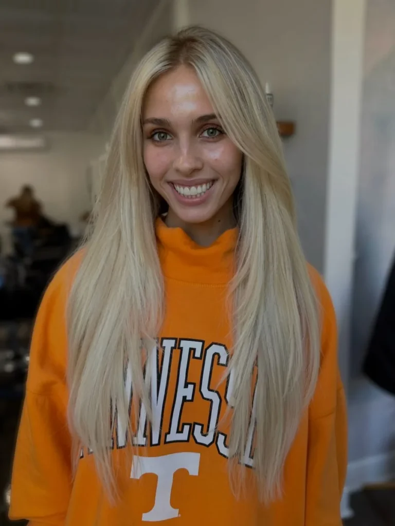 Long, straight light golden blonde hair with face-framing layers, lengthened with 24-inch extensions